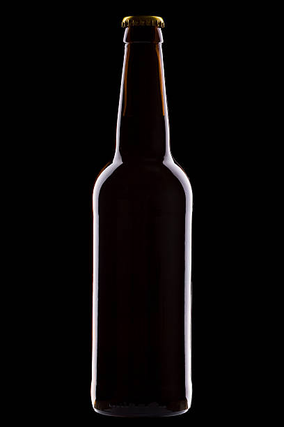 istock One bottle of beer isolated on black background 488309436