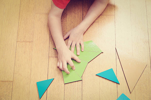 istock little boy playing with puzzle, early education 488311074