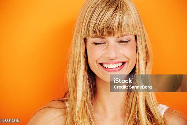 Young Blond Woman Laughing Stock Photo - Download Image Now - Smiling, One Woman Only, Blond Hair