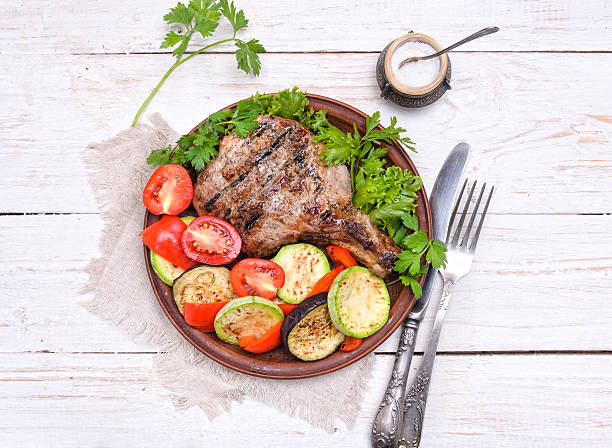 istock Grilled rib with grilled vegetables. 488313130