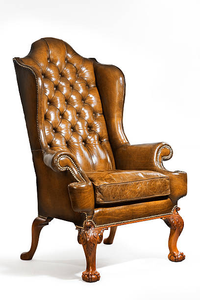 istock antique leather wing chair carved legs isolated on white 488313892