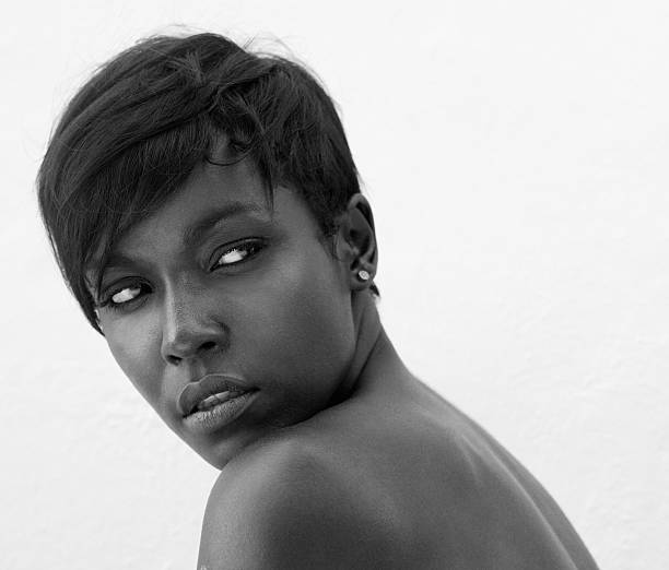 istock Black female fashion model posing on white background 488315000