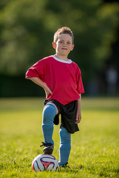 istock Little Boy Posing on Soccer Field 488316234