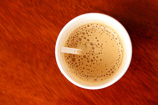 istock Hot coffee in paper cup seen from top. 488316778