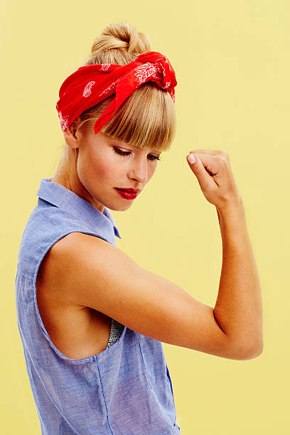 istock Gorgeous woman flexing muscle 488318320
