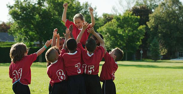 istock Kids Soccer Team Cheering their Teammate 488318542