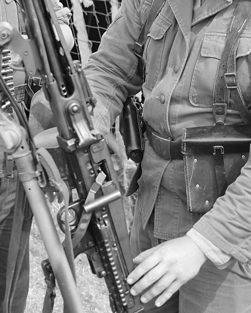 istock soldiers with heavy machine gun rifle 488319098