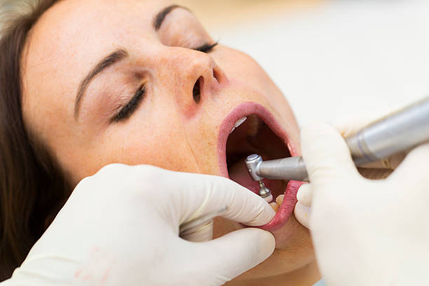 istock Cute young women at the dentist 488323917