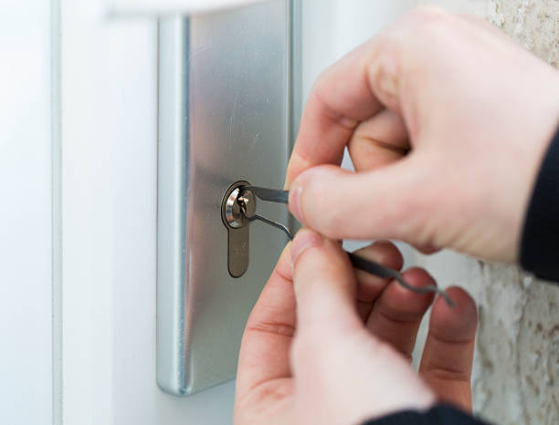 istock Burglar using special tools to break in  a house 488323945