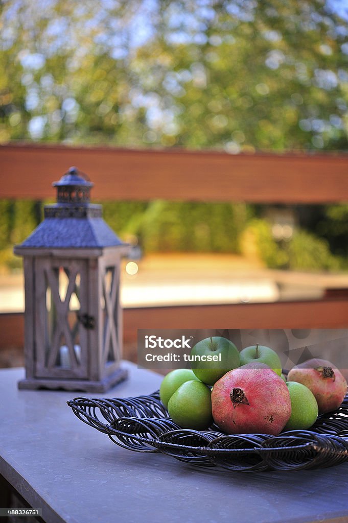 Healthy Lifestyle apples, pomegranates on the outdoor table Apple - Fruit Stock Photo