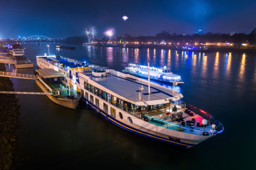 Passenger Boat on the Danube River with Fireworks in Background at Night