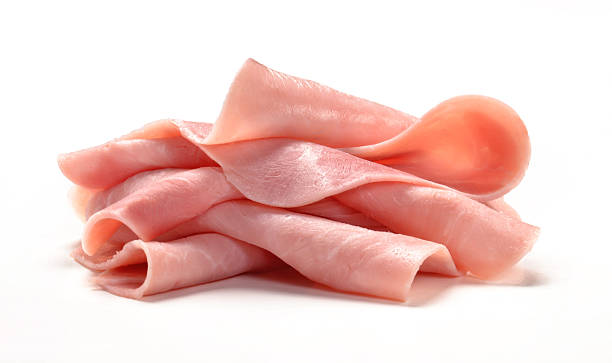 Fresh ham. Sliced smoked ham on white background.Sliced ham on white background.Fresh prosciutto.Pork ham sliced on white background. slice of food stock pictures, royalty-free photos & images