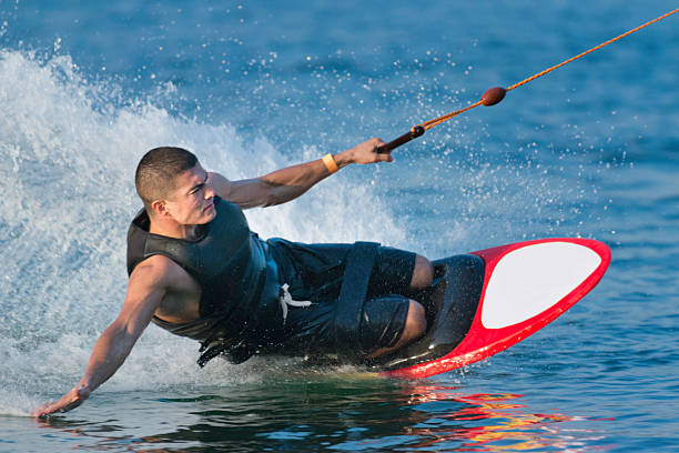 kneeboarding - wakeboarding surfing men vacations foto e immagini stock