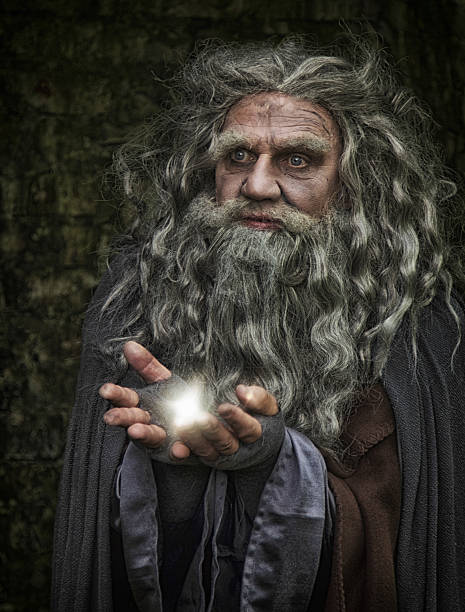 istock wizard with ball of light in his hands 488353232