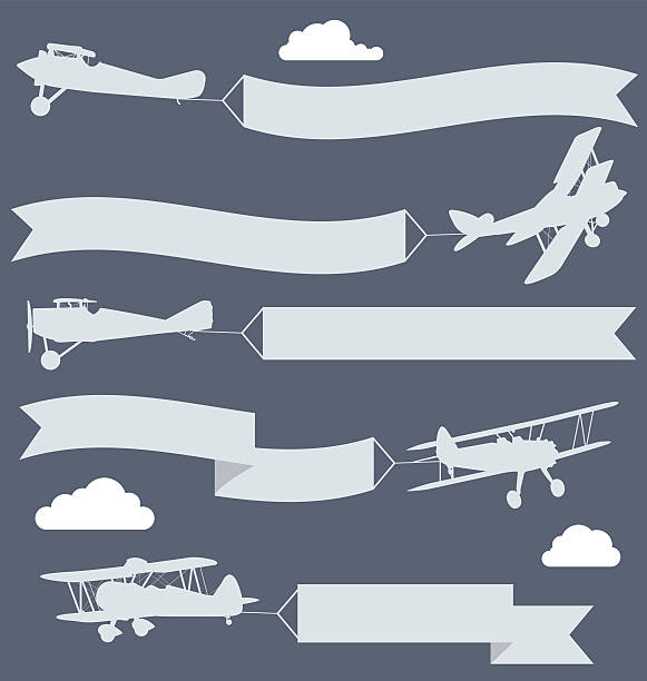 실루엣 of biplanes, 파형 인사 배너입니다 - airplane banner biplane retro revival stock illustrations