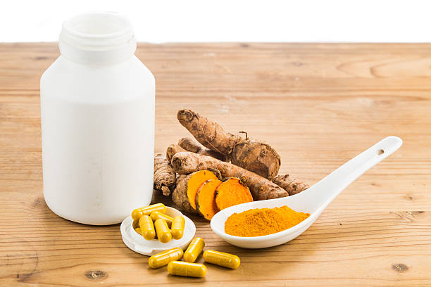 istock Homemade turmeric capsule from freshly grounded turmeric roots. 488355578