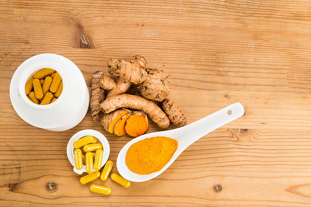 istock Homemade turmeric capsule from freshly grounded turmeric roots. 488355676