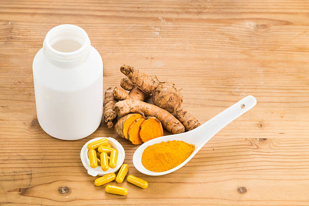 istock Homemade turmeric capsule from freshly grounded turmeric roots. 488355746