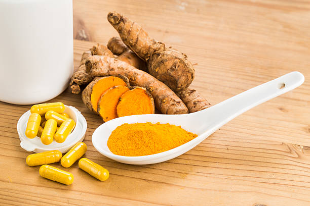 istock Homemade turmeric capsule from freshly grounded turmeric roots. 488355790