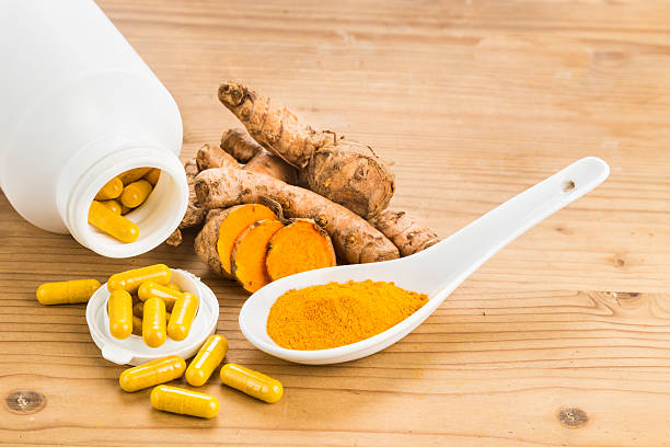 istock Homemade turmeric capsule from freshly grounded turmeric roots. 488355852