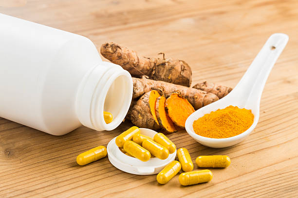 Homemade turmeric capsule from freshly grounded turmeric roots.