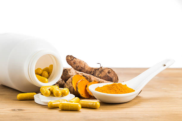 istock Homemade turmeric capsule from freshly grounded turmeric roots. 488356050