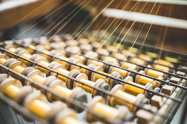 Detail of traditional loom machine used in trimmings textile manufacturing stock photo