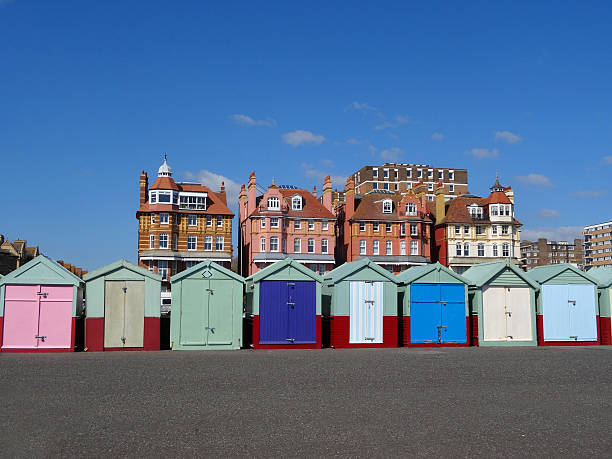 istock Image of rainbow coloured beach huts on Brighton seaside promenade 488358686