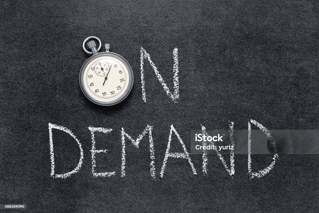 on demand on demand phrase handwritten on chalkboard with vintage precise stopwatch used instead of O 2015 Stock Photo