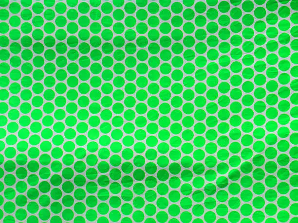 Green Polka dotted cloth on float at local fiesta in Alora, Andalucia