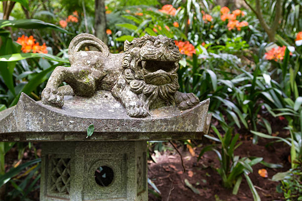 istock Foo Dog sculpture in a Tropical Garden 488361610