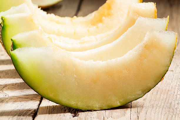 istock Ripe sliced  melon on a wooden background 488363172