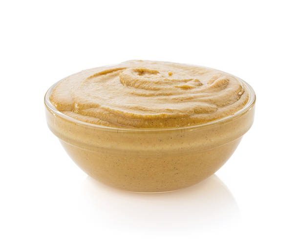 istock mustard sauce in bowl on white 488363475