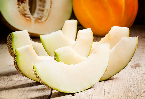istock Ripe sliced  melon on a wooden background 488363530