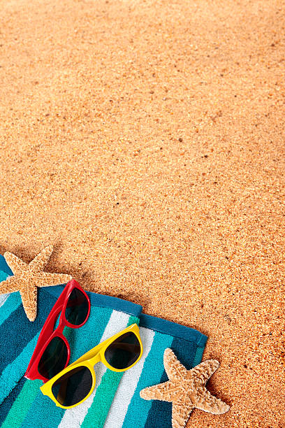 istock Beach background scene with sunglasses and starfish 488363705