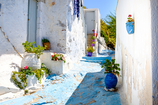 Beautiful street in old traditional Greek cycladic village Plaka, Milos island, Greece