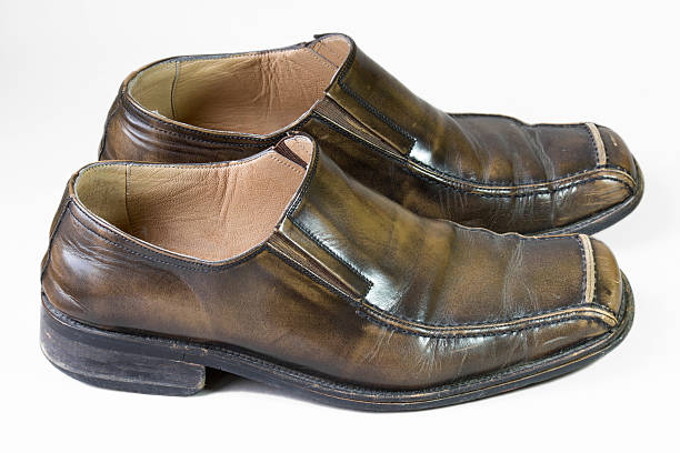 istock old brown male shoes (side view) 488365038