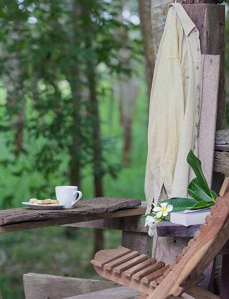 istock relaxation corner with coffee bread and book,  forest background 488365251
