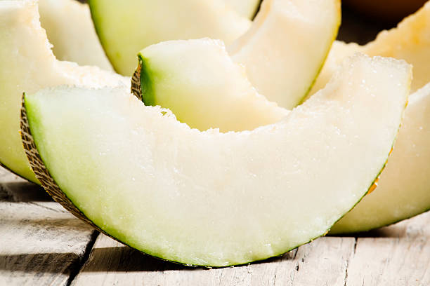 istock Ripe sliced  melon on a wooden background 488365266