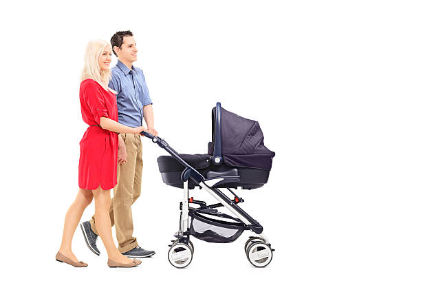 istock Young parents pushing a baby stroller 488365499