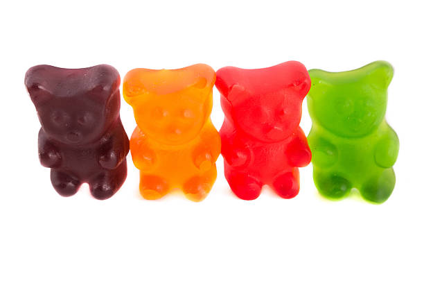 istock Row of colorful gummy bears on isolated white background 488366123