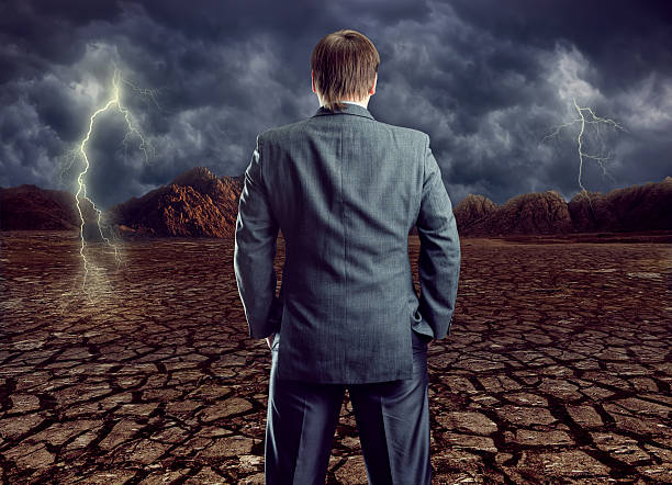 istock Businessman staying against cloudy sky 488367041
