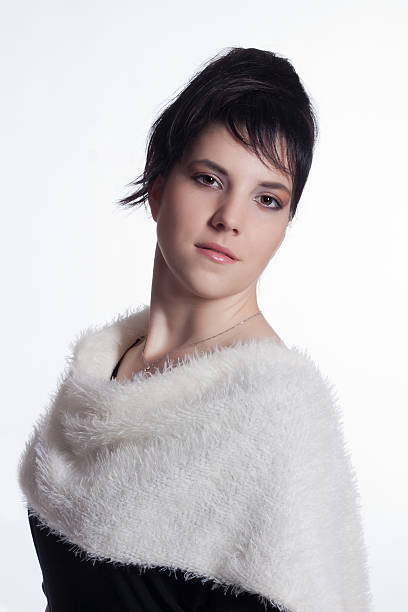 Young woman in black with white fur collar stock photo