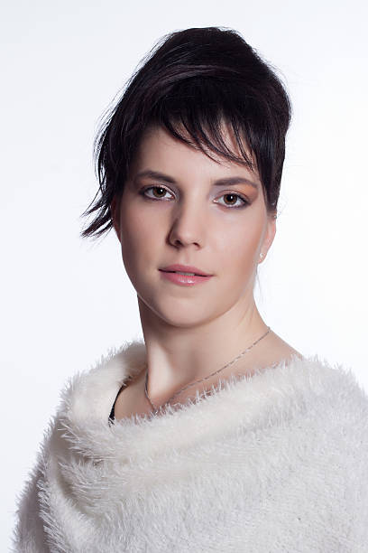Young woman in black with white fur collar stock photo
