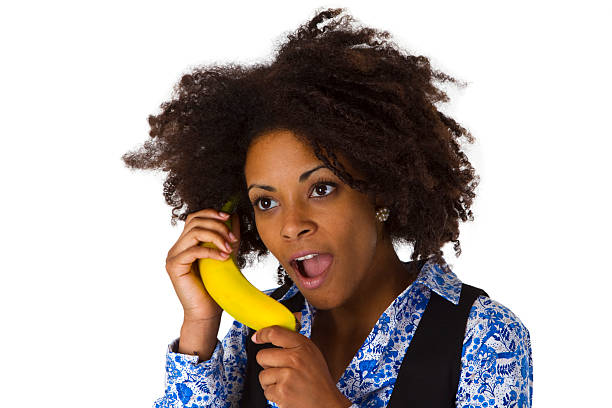 istock Female afro american with banana 488369287
