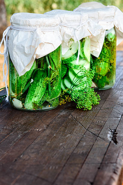 istock Pickled cucumbers made with home garden vegetables and herbs 488377370