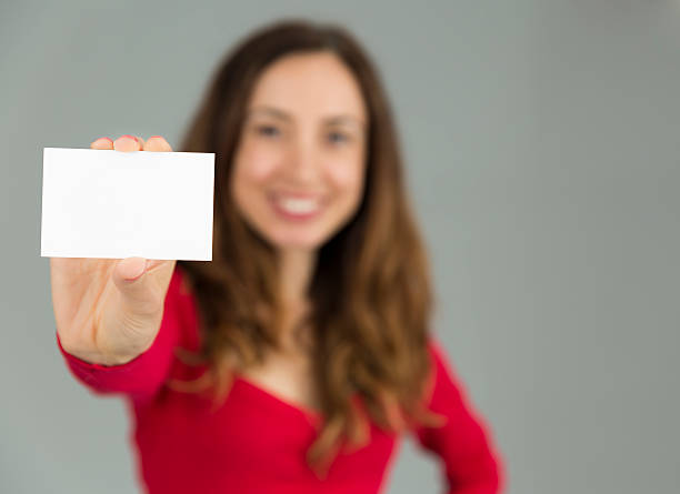 istock Woman presenting sign card 488377402