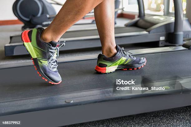 Close Up Man Feet Running On The Treadmill Stock Photo - Download Image Now - 2015, Active Lifestyle, Activity