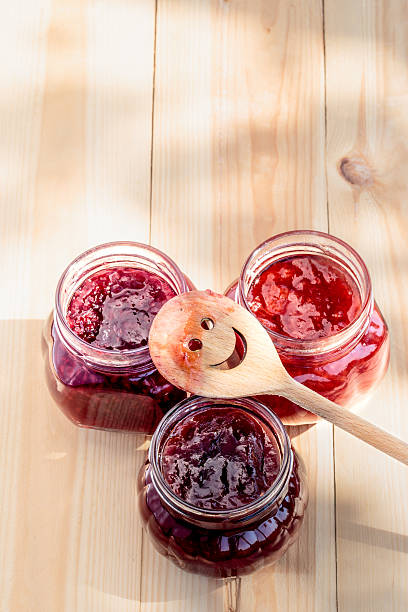 istock Homemade jam on wooden table 488380712
