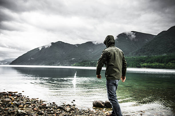 istock Solitude man sad alone on the lake 488385772